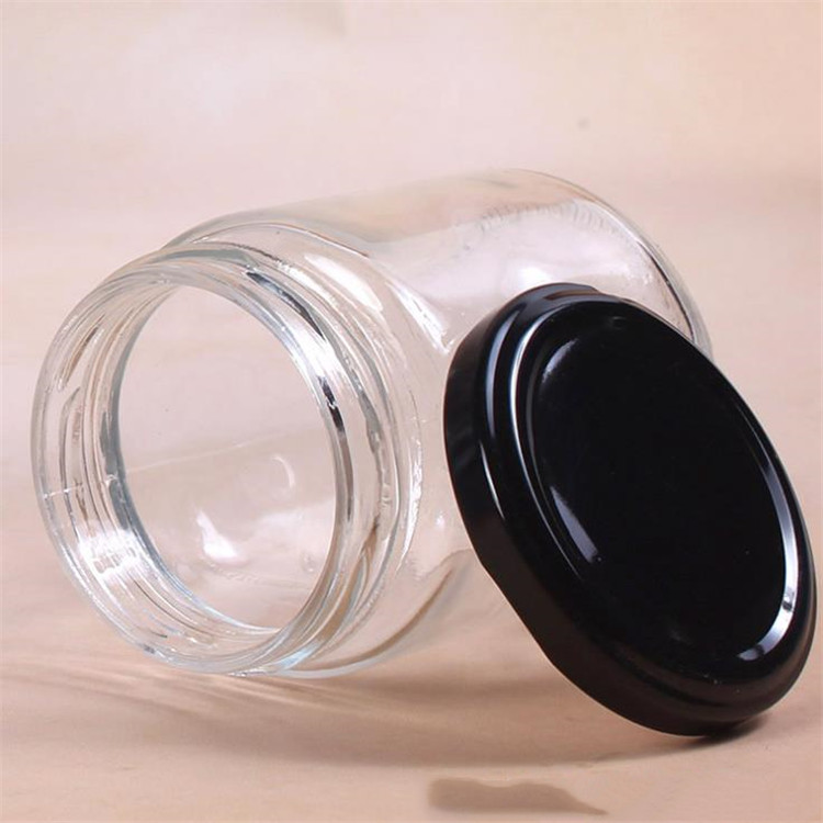 250ml wholesale round glass bottles food glass jars with black tin metal lid for honey candy packaging