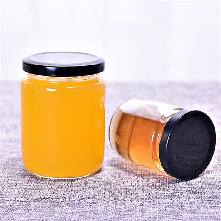 250ml wholesale round glass bottles food glass jars with black tin metal lid for honey candy packaging
