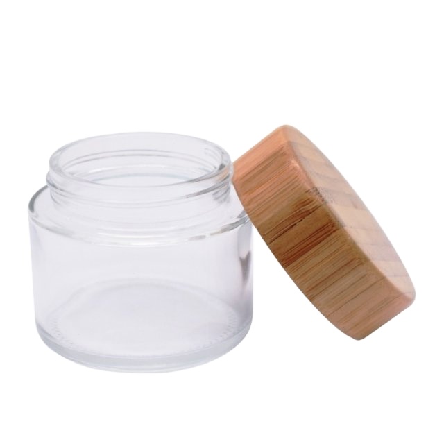 2oz wooden glass jar with child proof cap for hemp packaging 60ml child resistant clear glass jar bamboo lid child