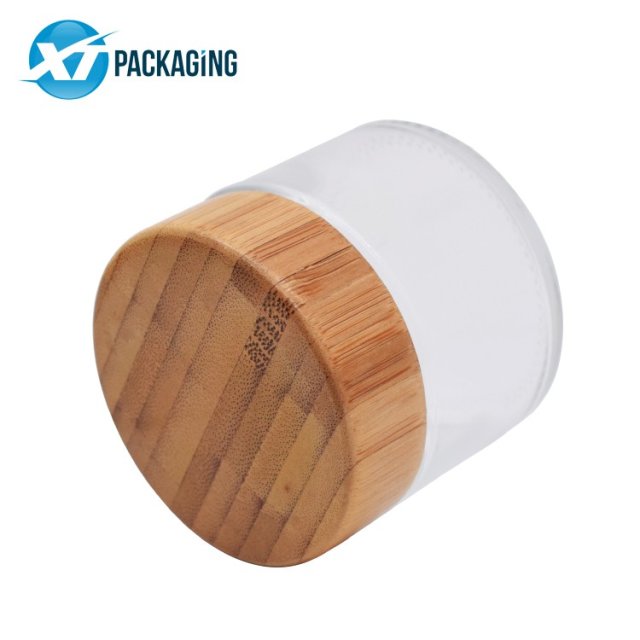 2oz wooden glass jar with child proof cap for hemp packaging 60ml child resistant clear glass jar bamboo lid child