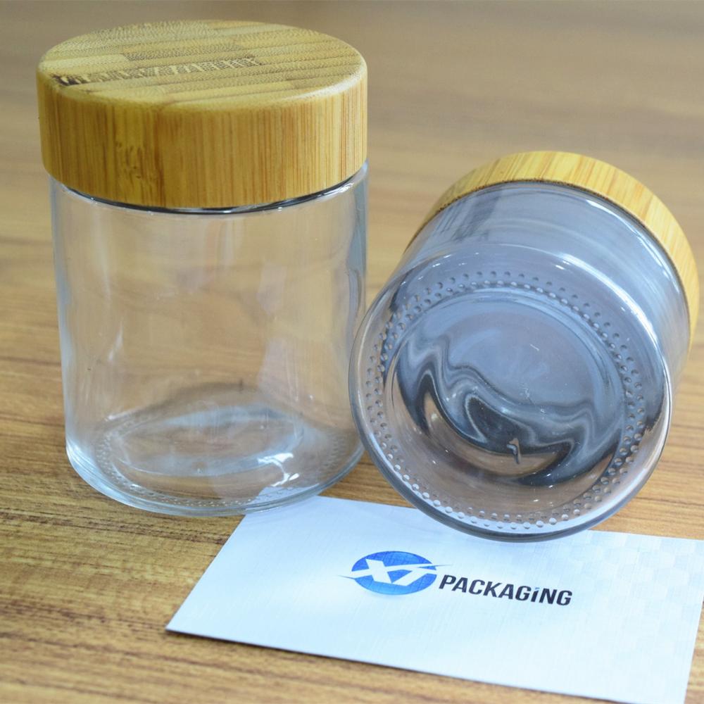 2oz wooden glass jar with child proof cap for hemp packaging 60ml child resistant clear glass jar bamboo lid child