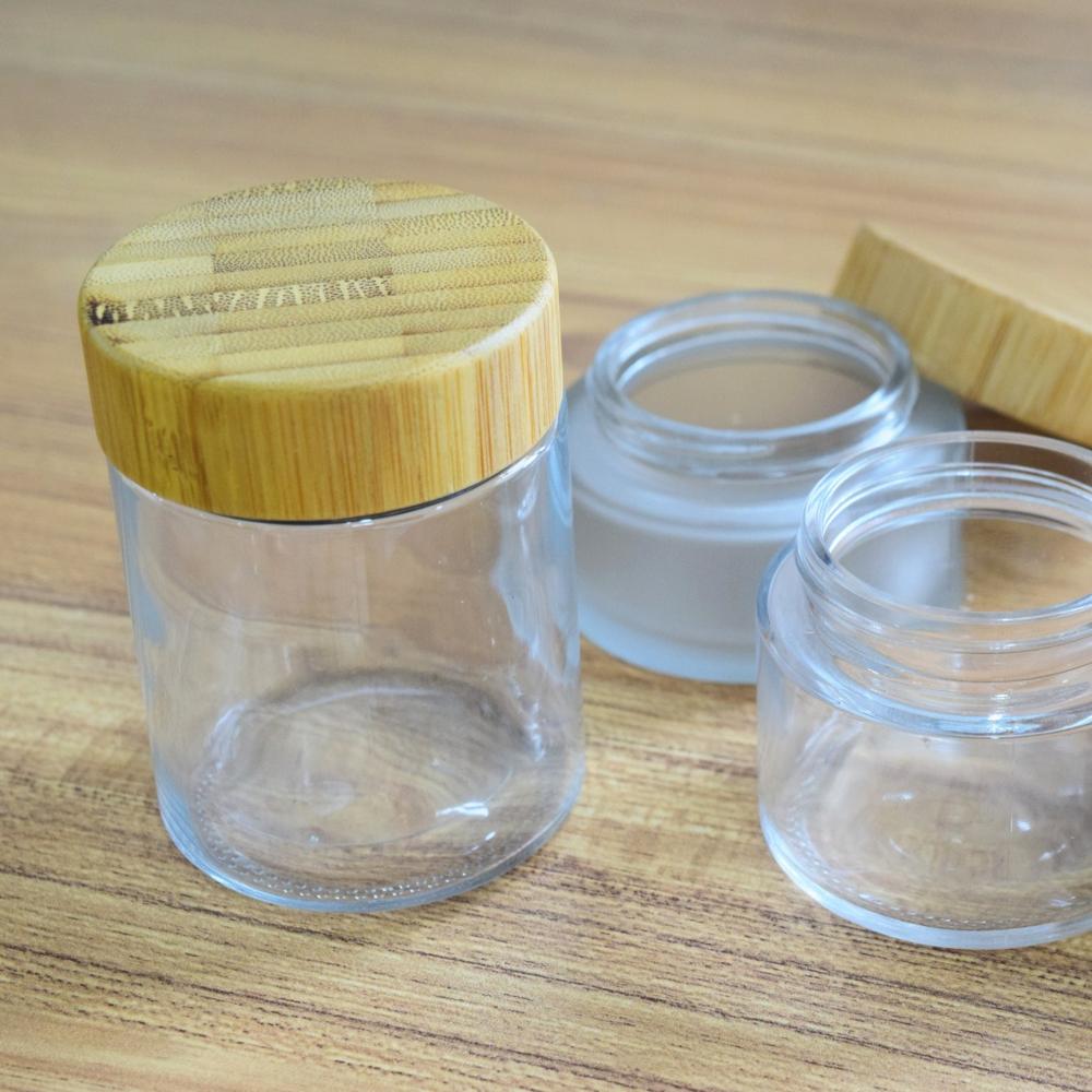2oz wooden glass jar with child proof cap for hemp packaging 60ml child resistant clear glass jar bamboo lid child