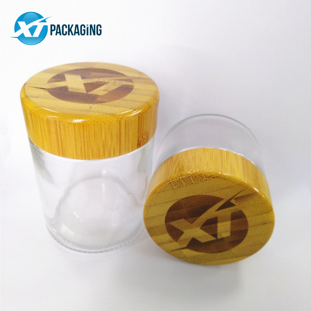 2oz wooden glass jar with child proof cap for hemp packaging 60ml child resistant clear glass jar bamboo lid child