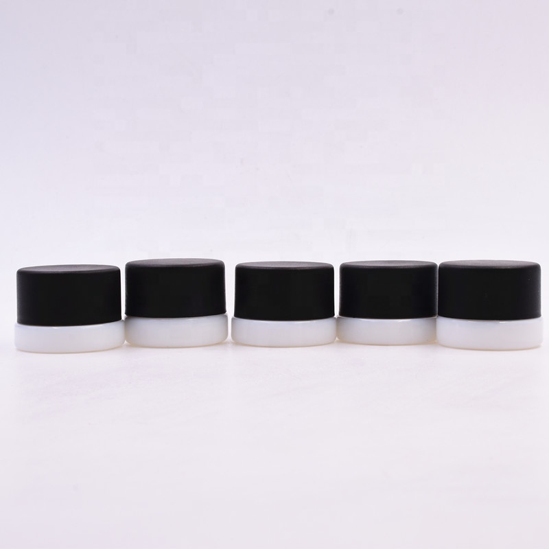 3 ml white round small straight side eye cream cosmetic packing glass jar with black plastic child proof lid.
