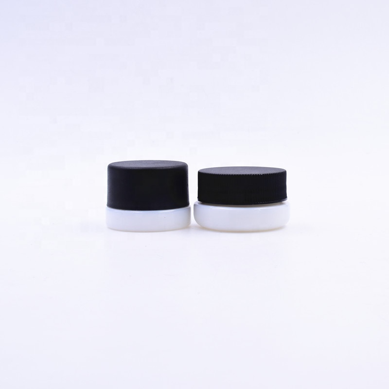3 ml white round small straight side eye cream cosmetic packing glass jar with black plastic child proof lid.