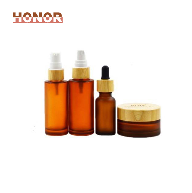 30 50 100g frosted amber glass skincare cream jar 10ml essential oil dropper bottle 100ml lotion spray bottle with bamboo top