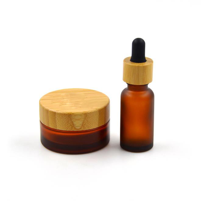 30 50 100g frosted amber glass skincare cream jar 10ml essential oil dropper bottle 100ml lotion spray bottle with bamboo top