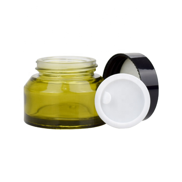 30g 50g wholesale fancy slant shoulder clear green glass cosmetic face eye cream jar for skin care with black plastic screw lid