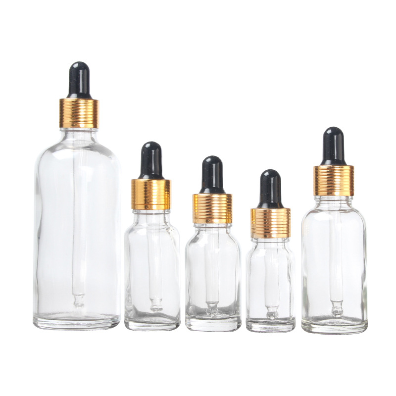 30ml 100ml  transparent glass bottle essential oil bottle with stopper gold cap for cosmetic packing