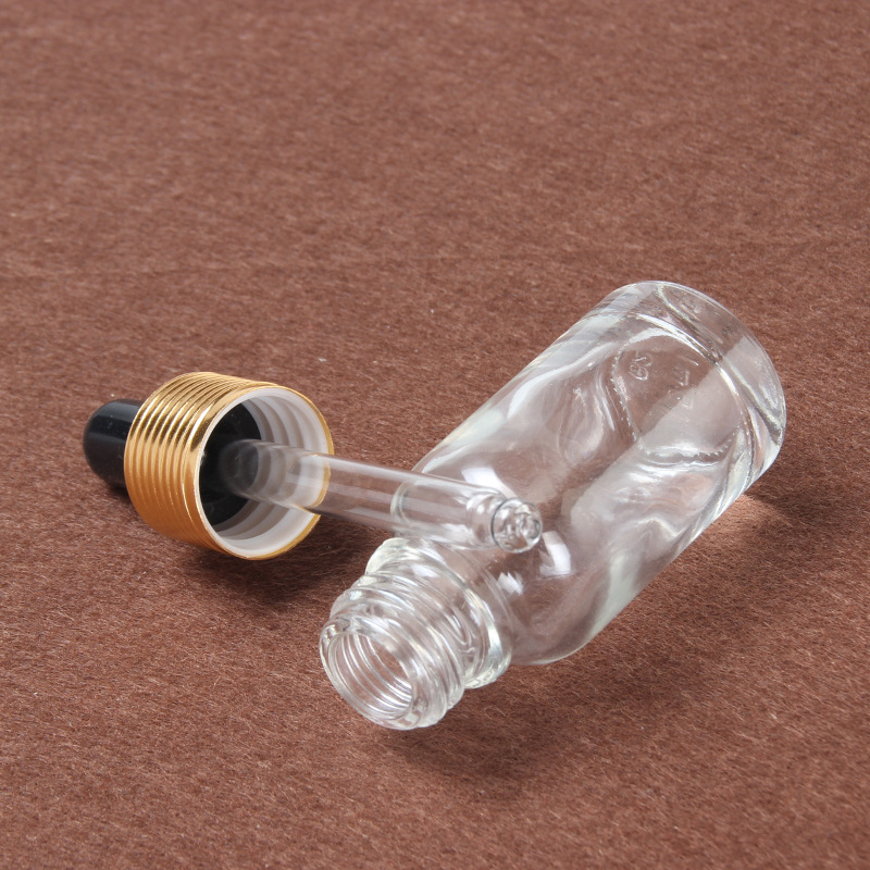 30ml 100ml transparent glass bottle essential oil bottle with stopper gold cap for cosmetic packing