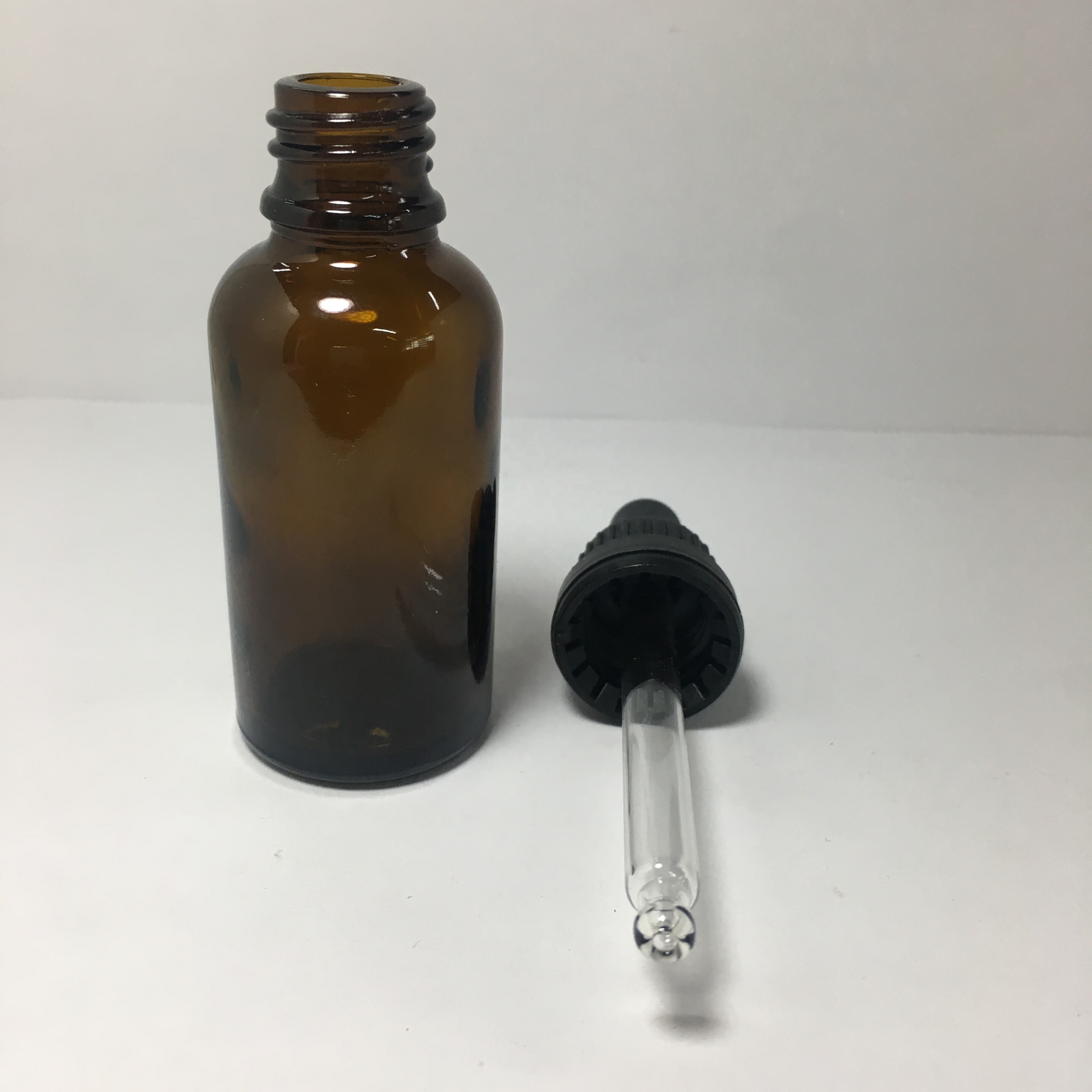 30ml 1oz amber essential oil glass bottle with child resistant and tamper evident glass dropper for cosmetic packaging