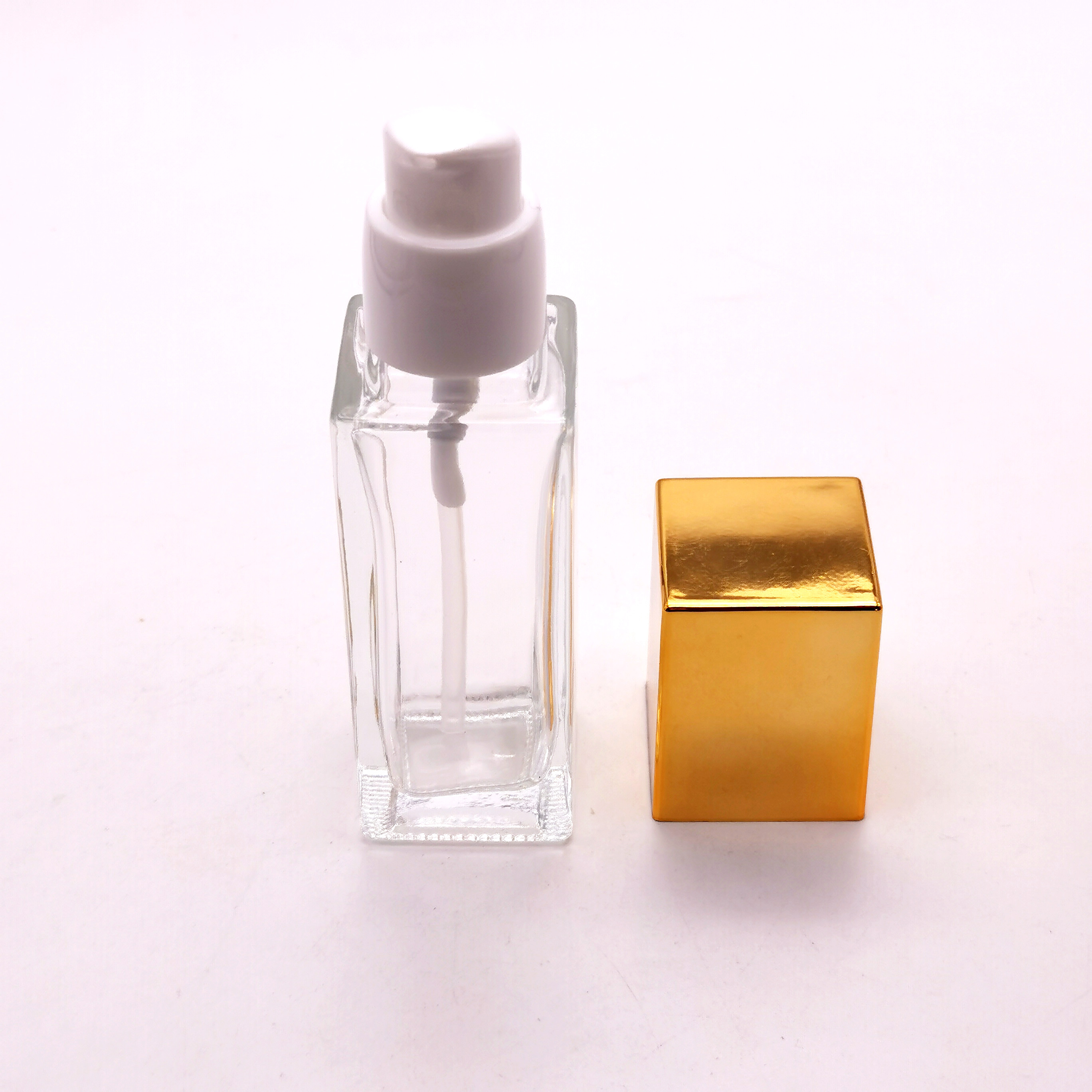 30ml 40 ml empty makeup liquid clear glass foundation bottle with black pump for cosmetics
