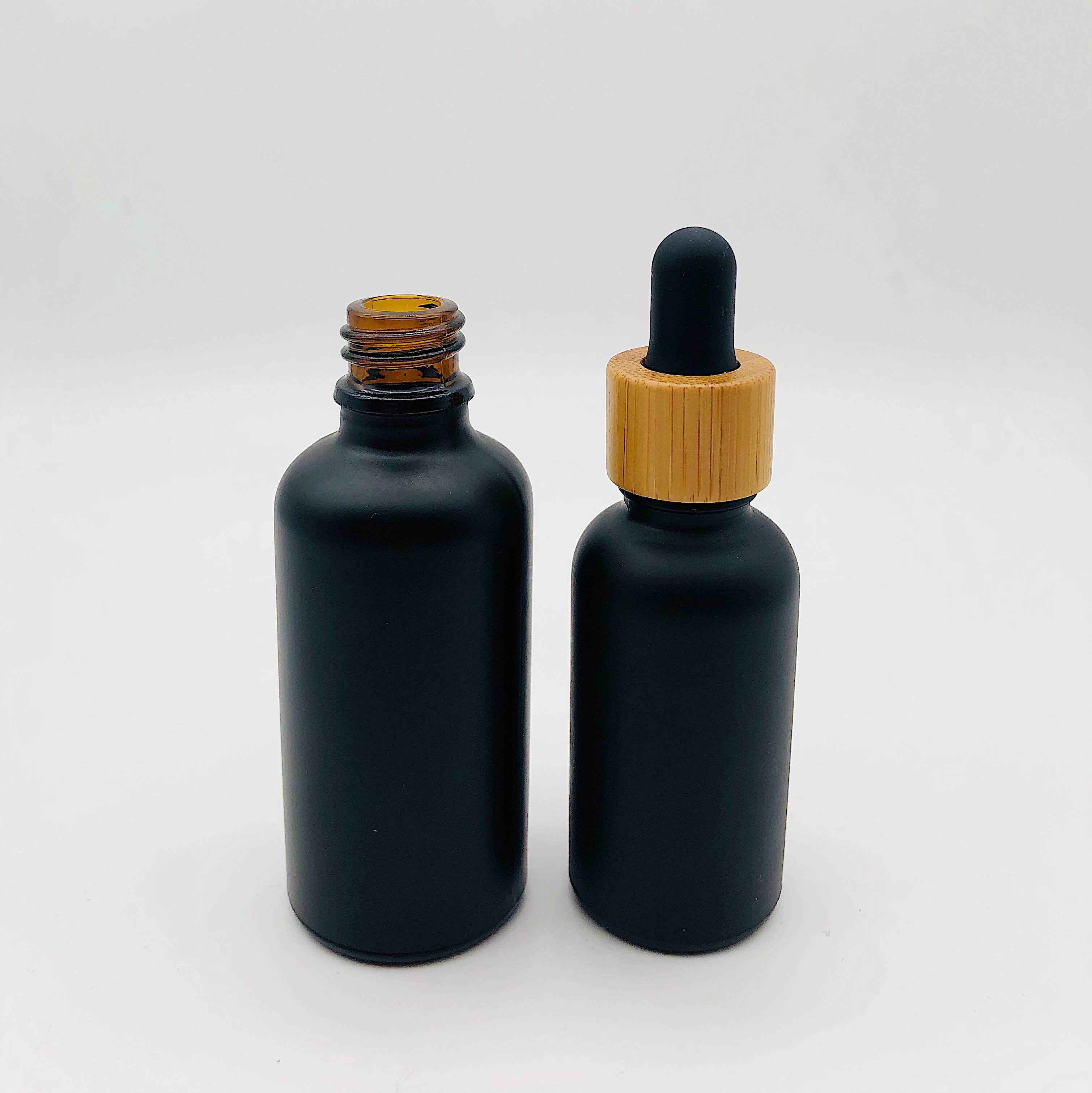30ml 50ml 100 ml Essential Oil Glass Dropper Bottle Matte Black Glass Bottle with Bamboo Cap