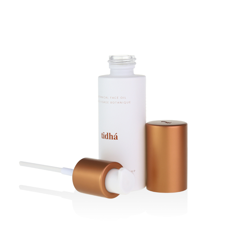 30ml glass serum bottles with copper pump embossed logo cap