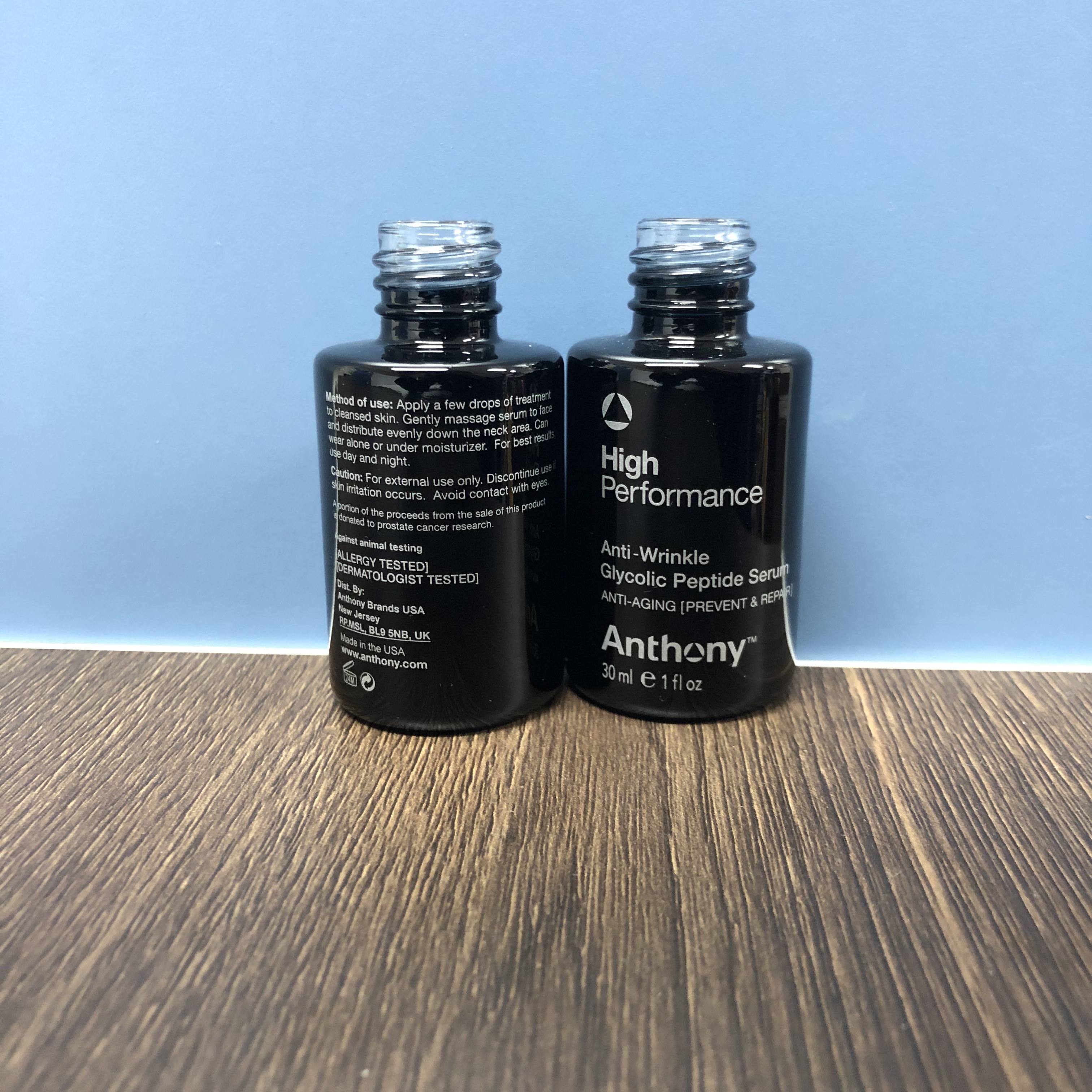 30ml glossy black color round glass bottle with one silver color silkscreen printing flat shoulder bottle