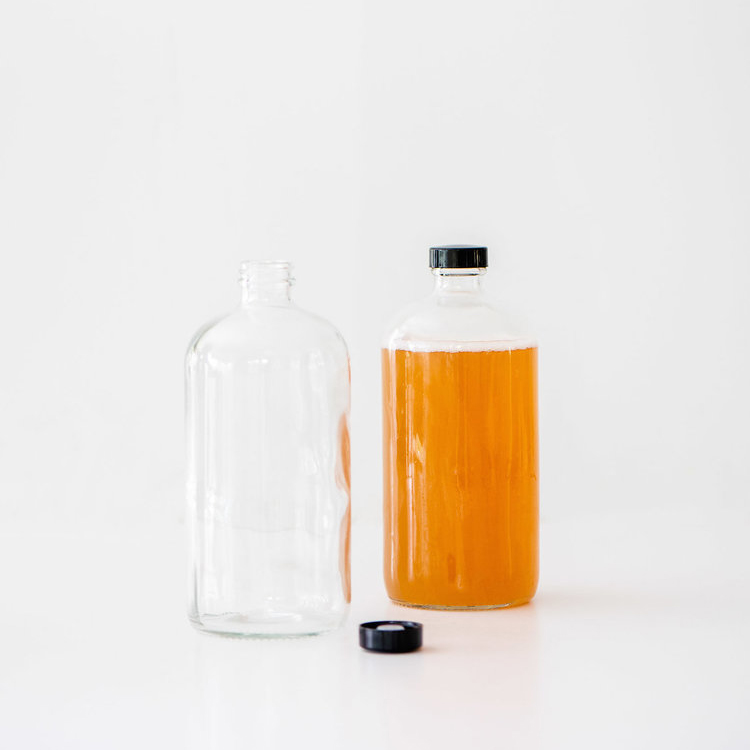 32 oz. Boston Round Clear Glass Bottle for Kombucha Mineral Water with Polyethylene Cone Caps