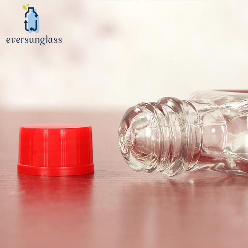 35ml Wholesale Custom Wholesale Clear Flat Safflower Oil Glass Bottle Essential Oil Bottle with Plastic Screw Lid for Liquor and