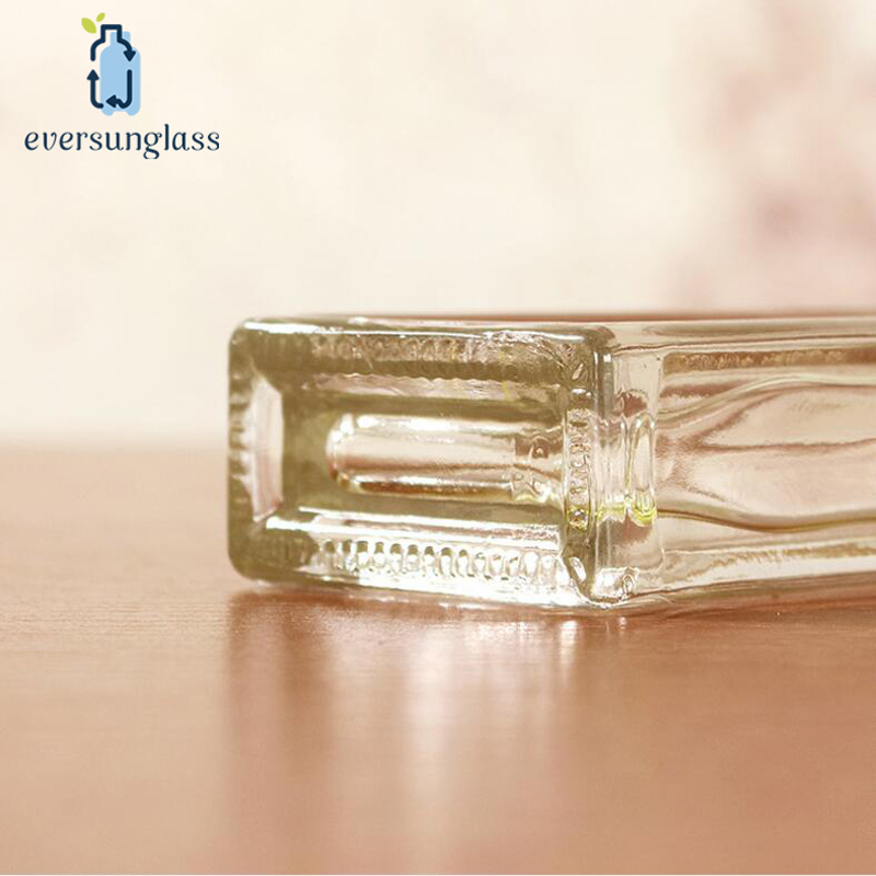 35ml Wholesale Custom Wholesale Clear Flat Safflower Oil Glass Bottle Essential Oil Bottle with Plastic Screw Lid for Liquor and