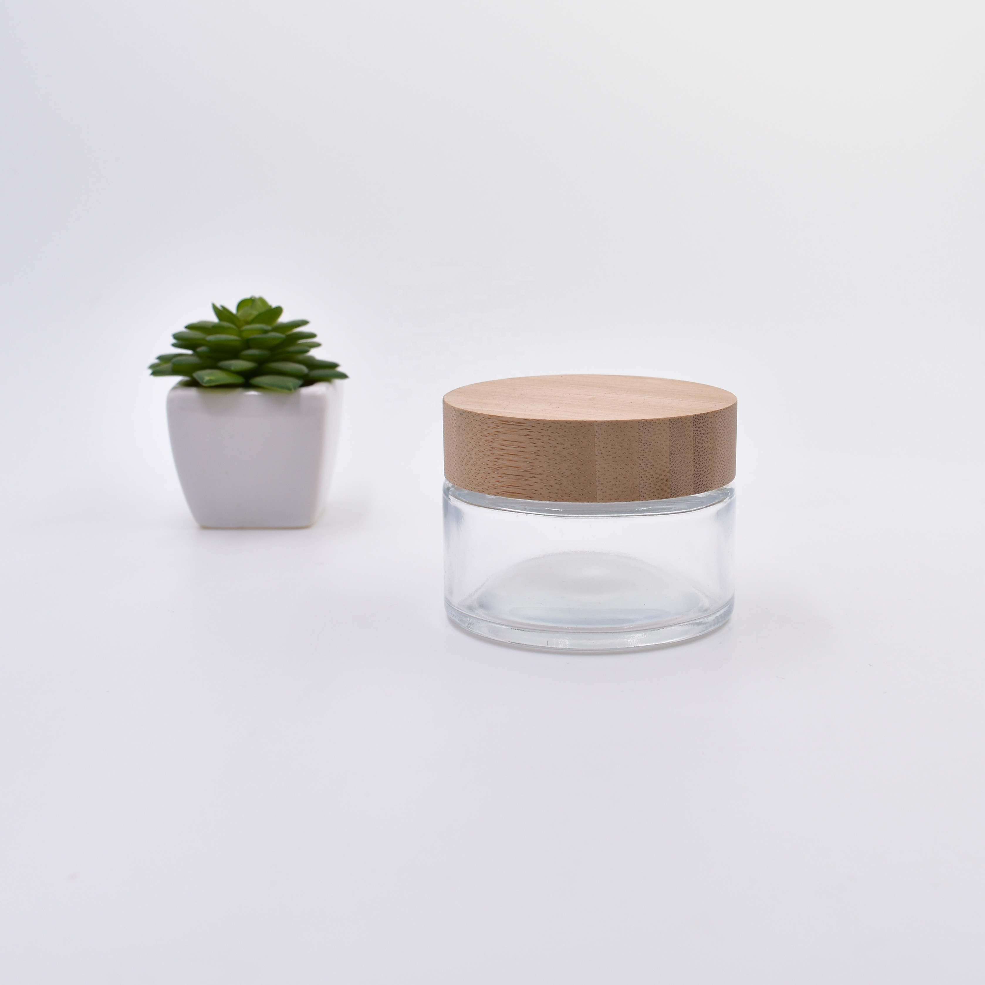 50 ml clear round shape face skin cream cosmetic packing glass jar with bamboo lid.