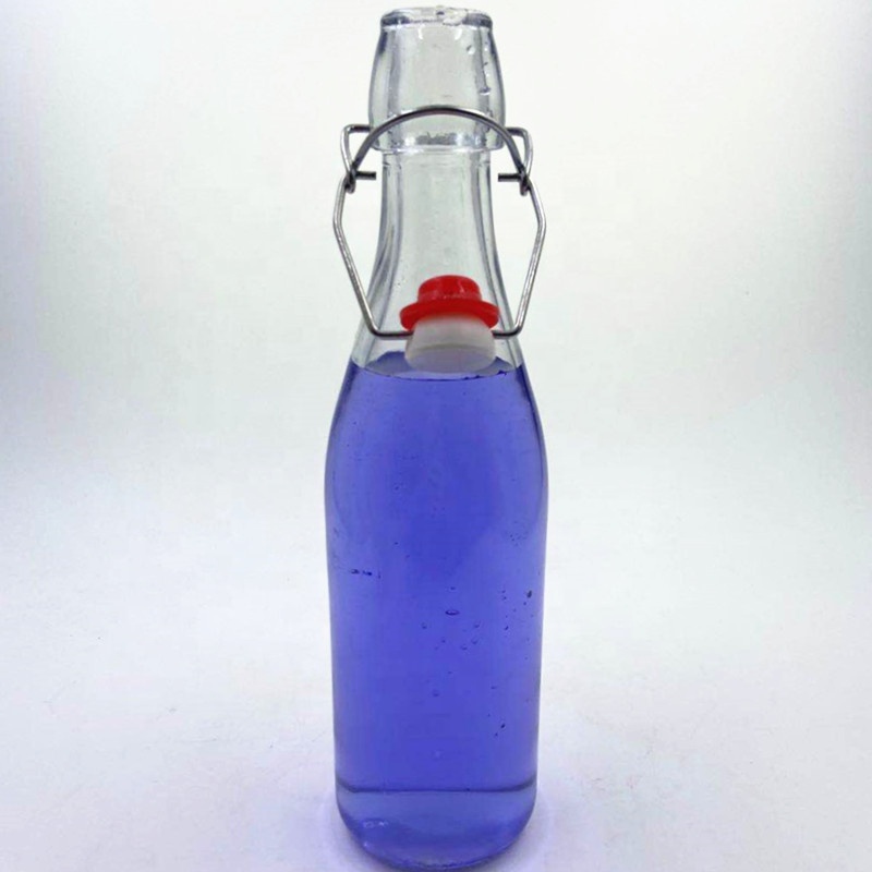 500 ml clear seal round liquid wine beer fruit juice Pu'er tea glass bottle with swing lid.