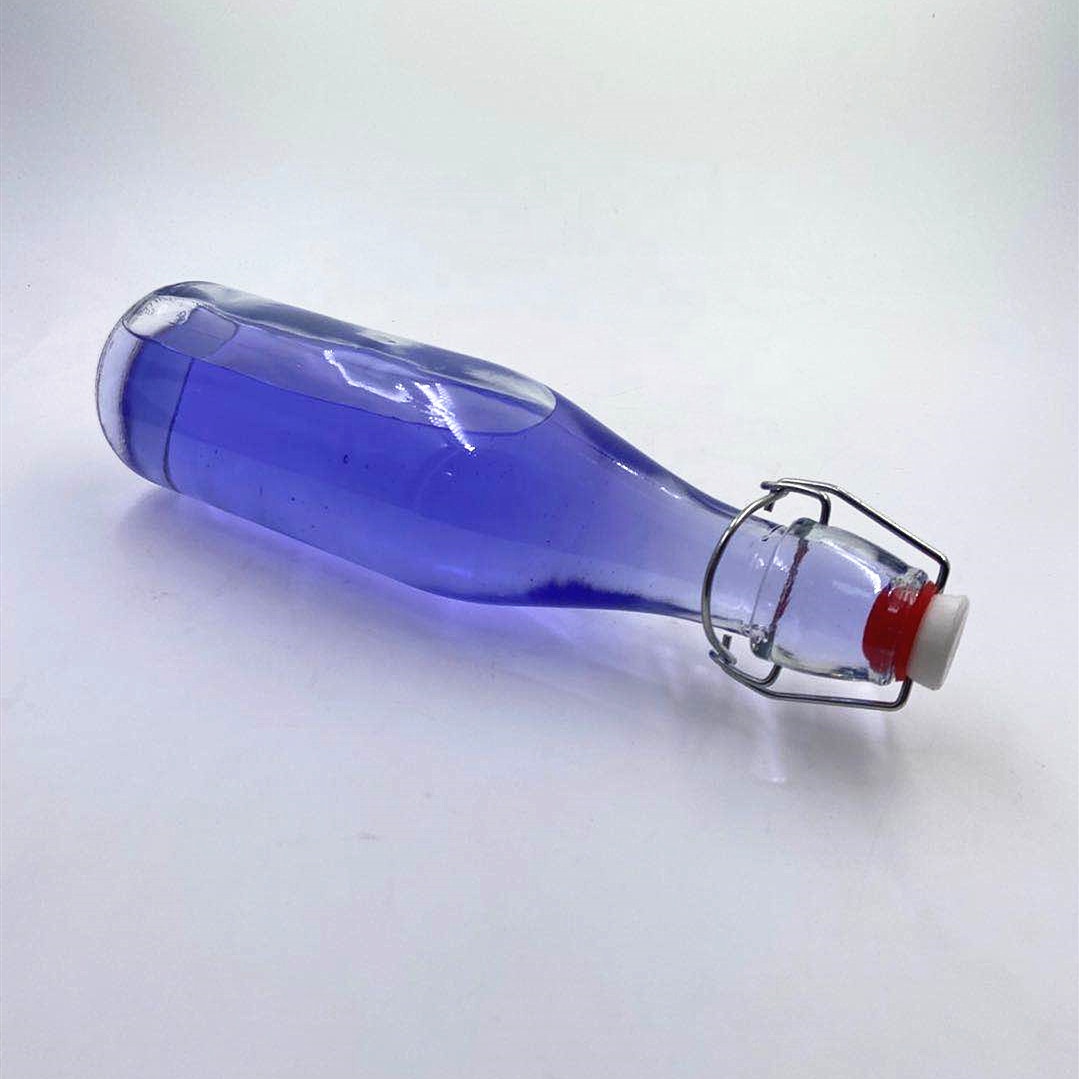 500 ml clear seal round liquid wine beer fruit juice Pu'er tea glass bottle with swing lid.