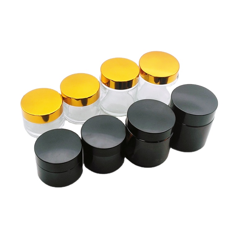 50g 70g 100g 120g clear amber round cosmetic glass face cream jar with golden black plastic cap