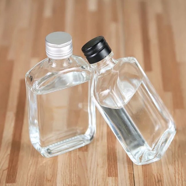 50ml-500ml Customized LOGO Elegant Liquor Glass Bottle,transparent or frosted glass bottle,whisky/wine/juice bottle