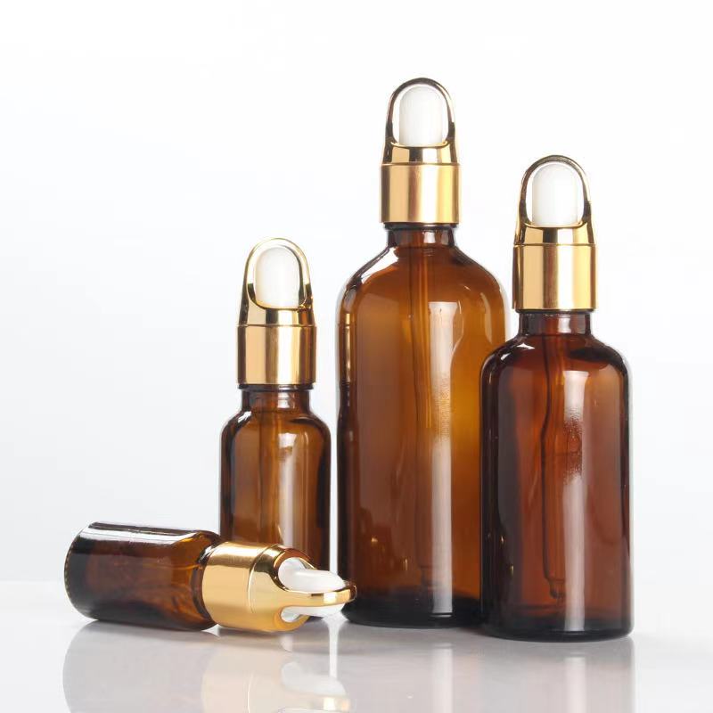 50ml amber glass essential oil dropper bottle with gold flower basket lid cap