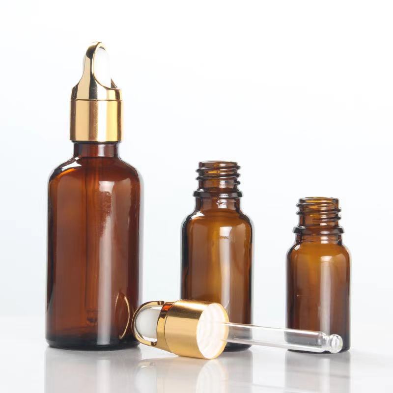 50ml amber glass essential oil dropper bottle with gold flower basket lid cap