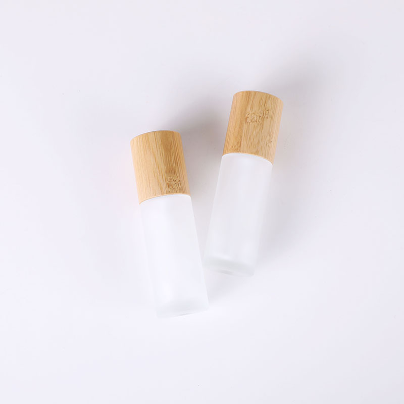 50ml bamboo lid glass bottle frosted glass lotion pump bottle with bamboo lid