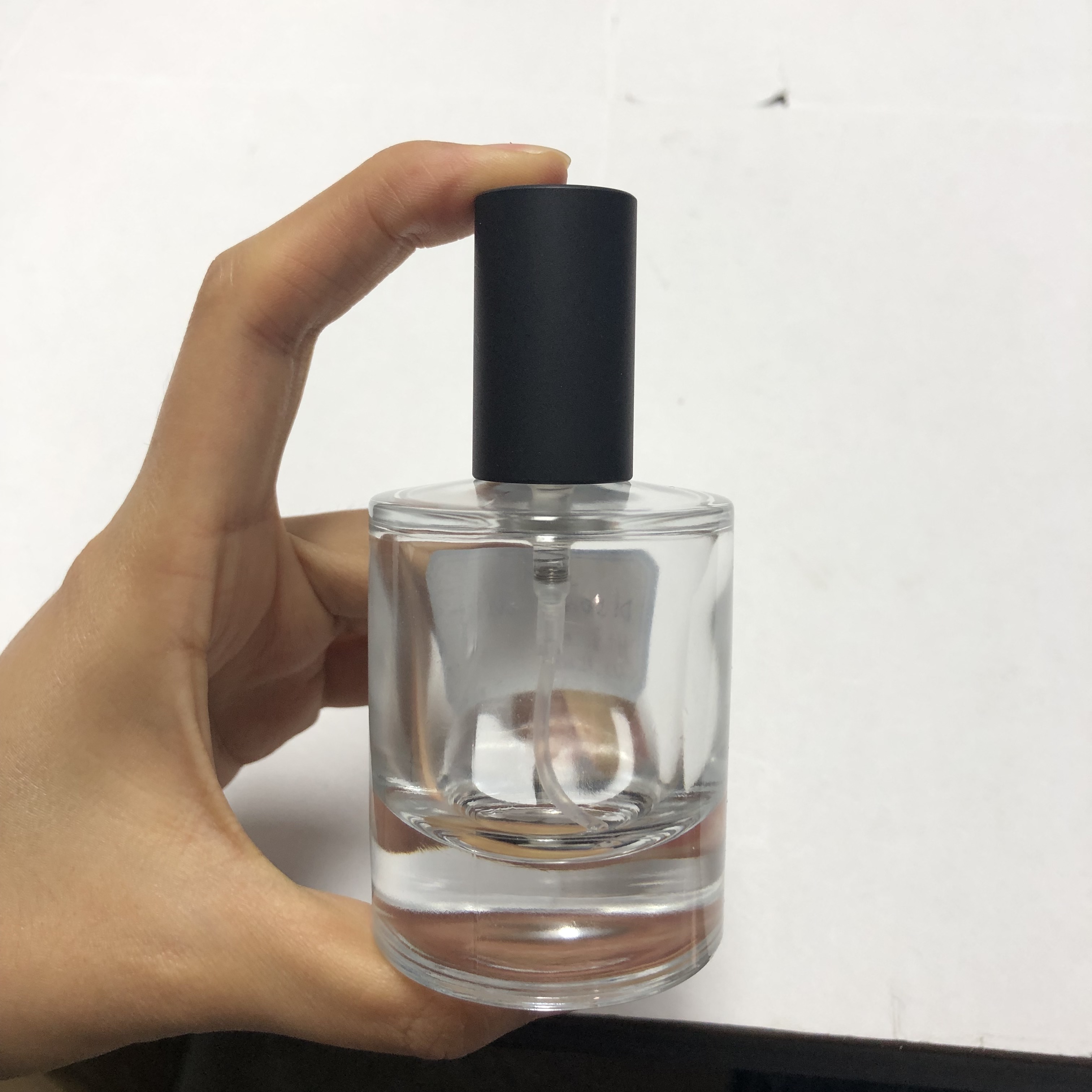 50ml high premium quality round glass perfume bottle with thick bottom and 15mm neck finish wholesale
