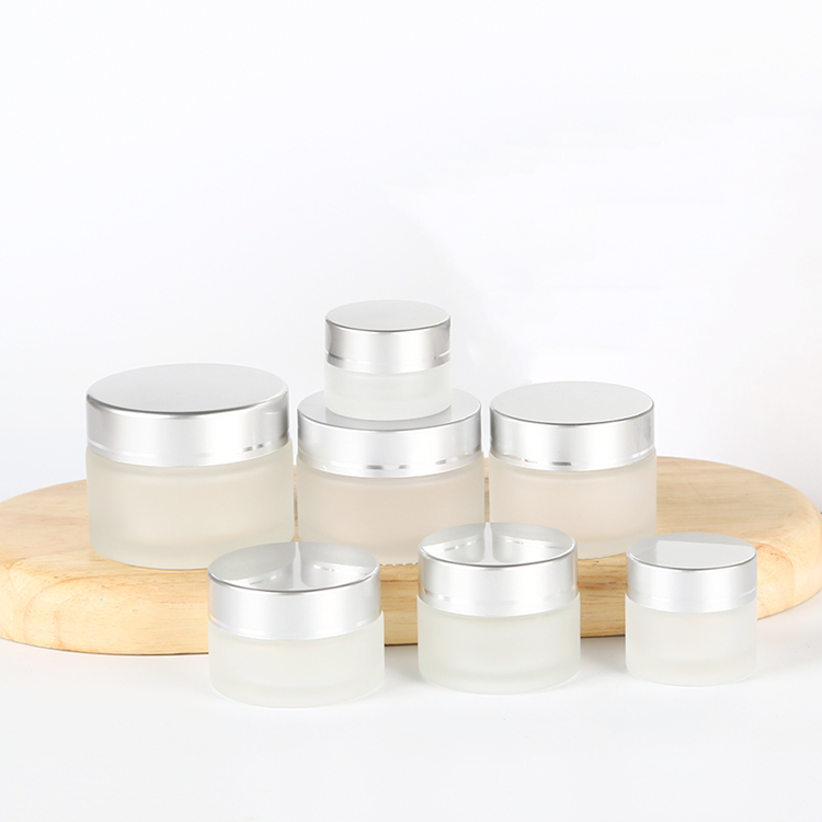 5g to 100g frosted round glass jar with golden black sliver plastic cap for lotions eye creams