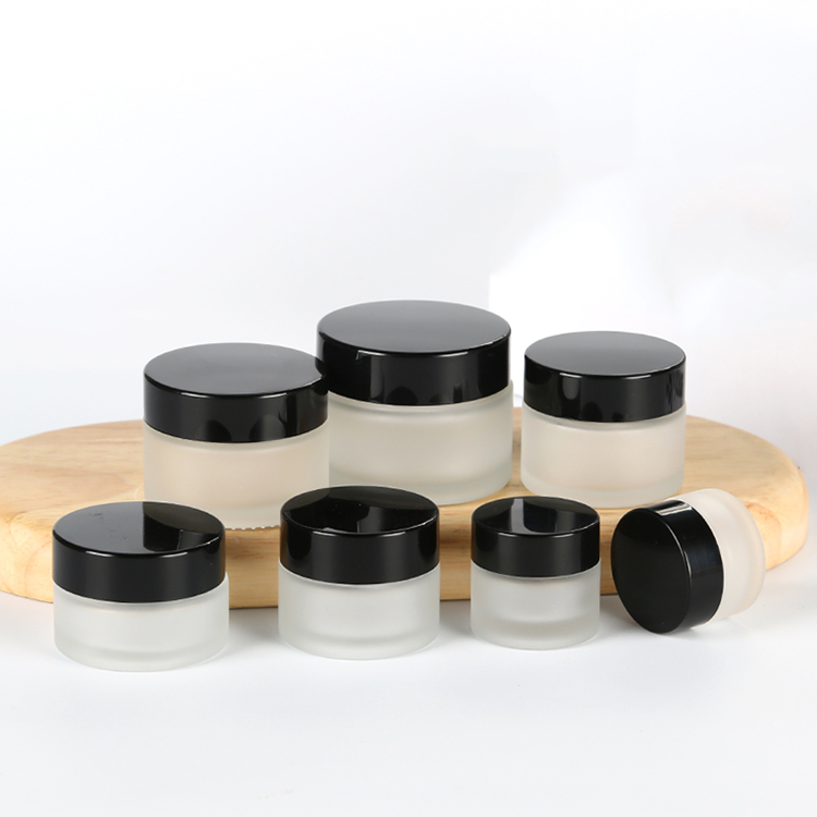 5g to 100g frosted round glass jar with golden black sliver plastic cap for lotions eye creams