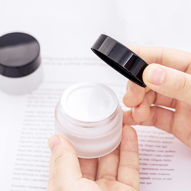 5g to 100g frosted round glass jar with golden black sliver plastic cap for lotions eye creams