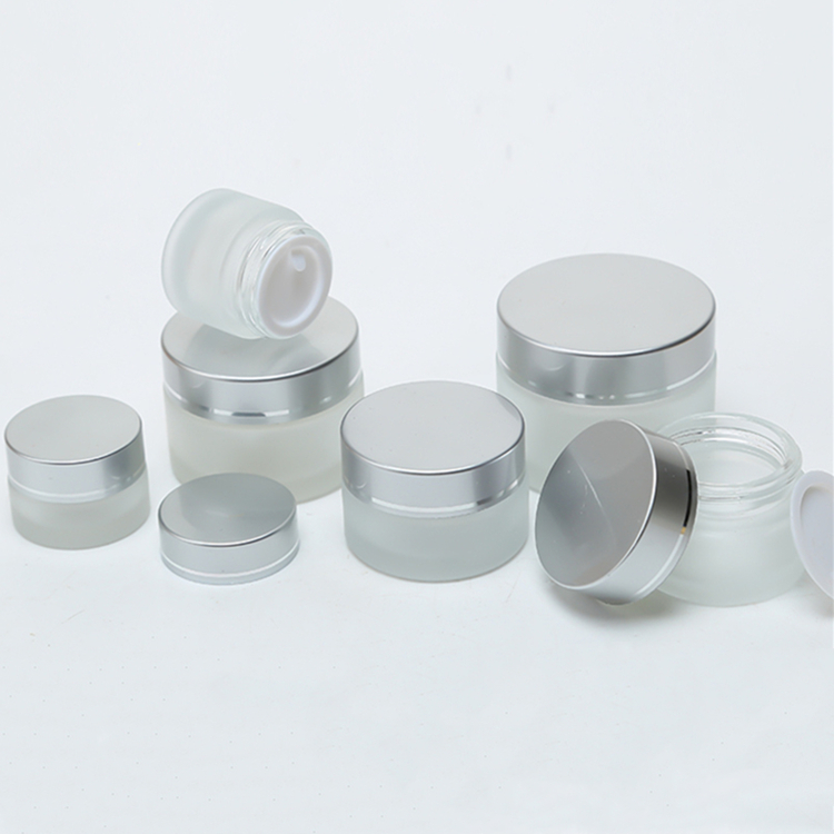 5g to 100g frosted round glass jar with golden black sliver plastic cap for lotions eye creams