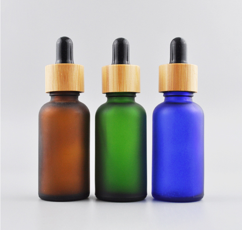 5ml 10ml 15ml 20ml 30ml 50ml 100ml frosted green blue amber clear essential oil glass dropper bottle with bamboo lid