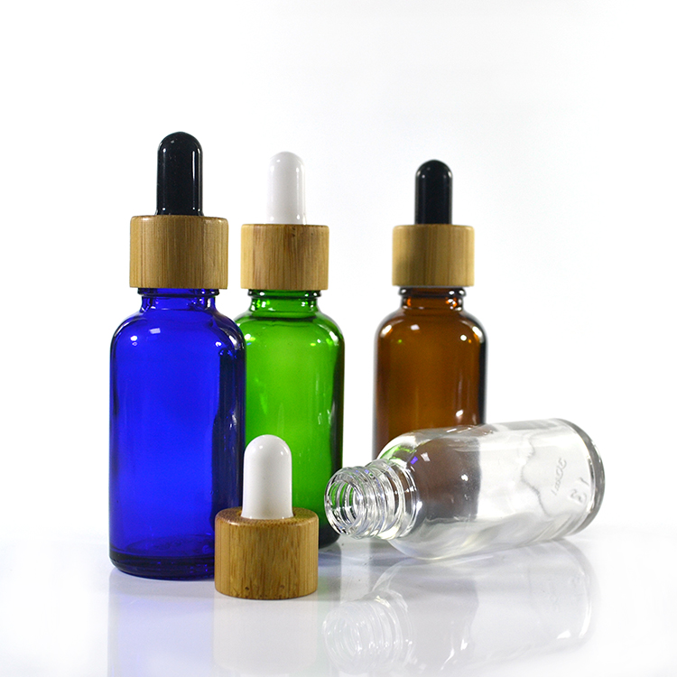 5ml 10ml 15ml 20ml 30ml 50ml 100ml frosted green blue amber clear essential oil glass dropper bottle with bamboo lid