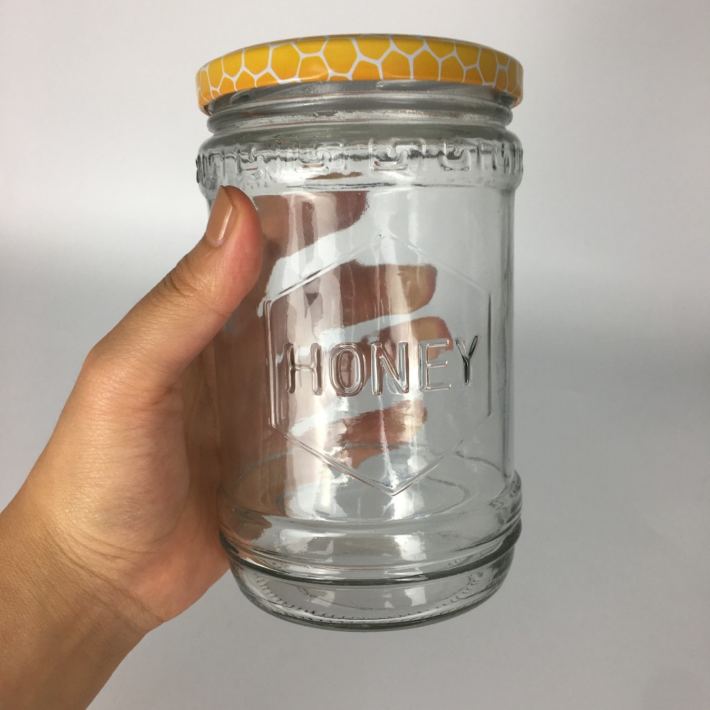600ml 700g embossed with honey logo glass honey jar hot sale In the Middle East