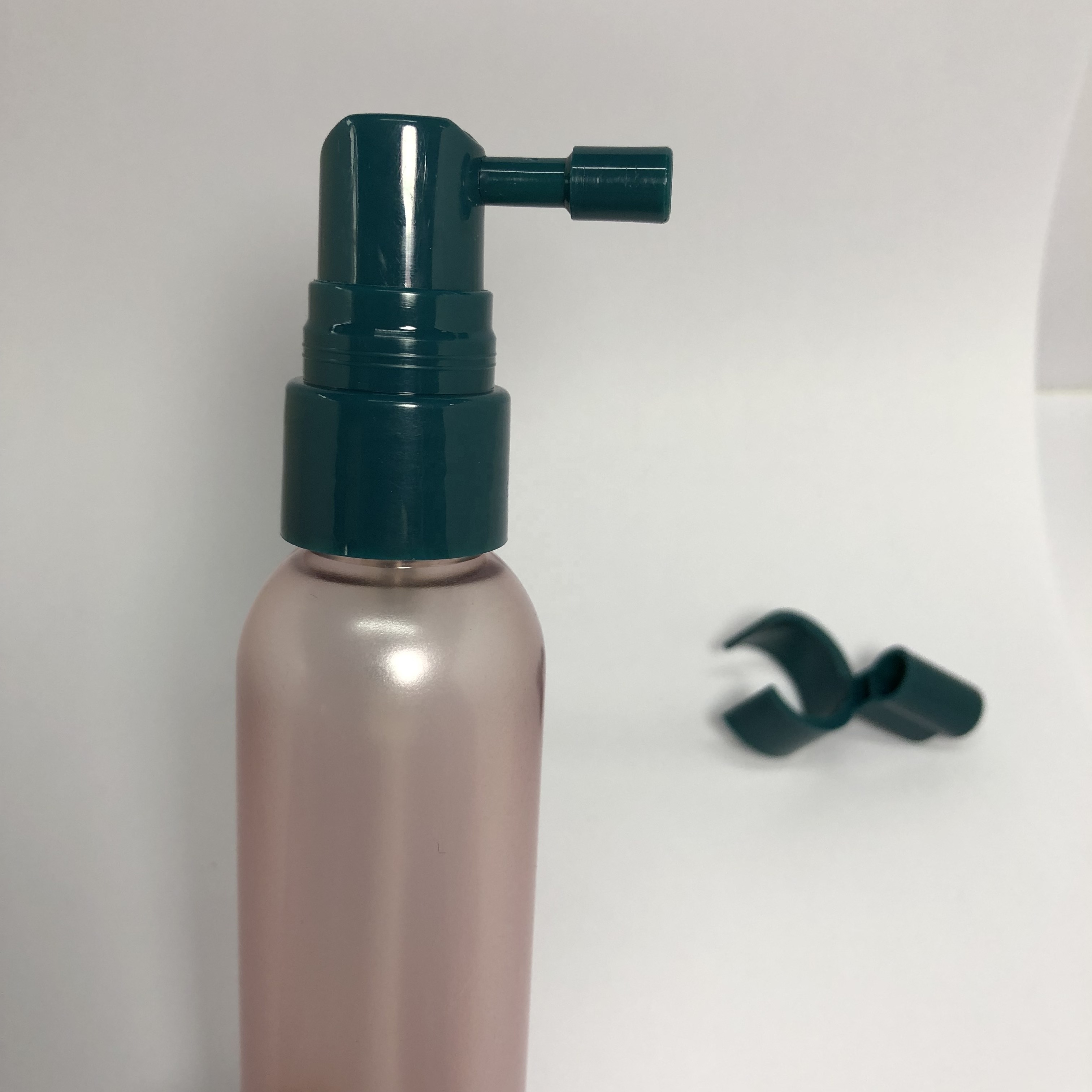 60ml pink semi-transparent plastic bottle with 20mm green sprayer pump