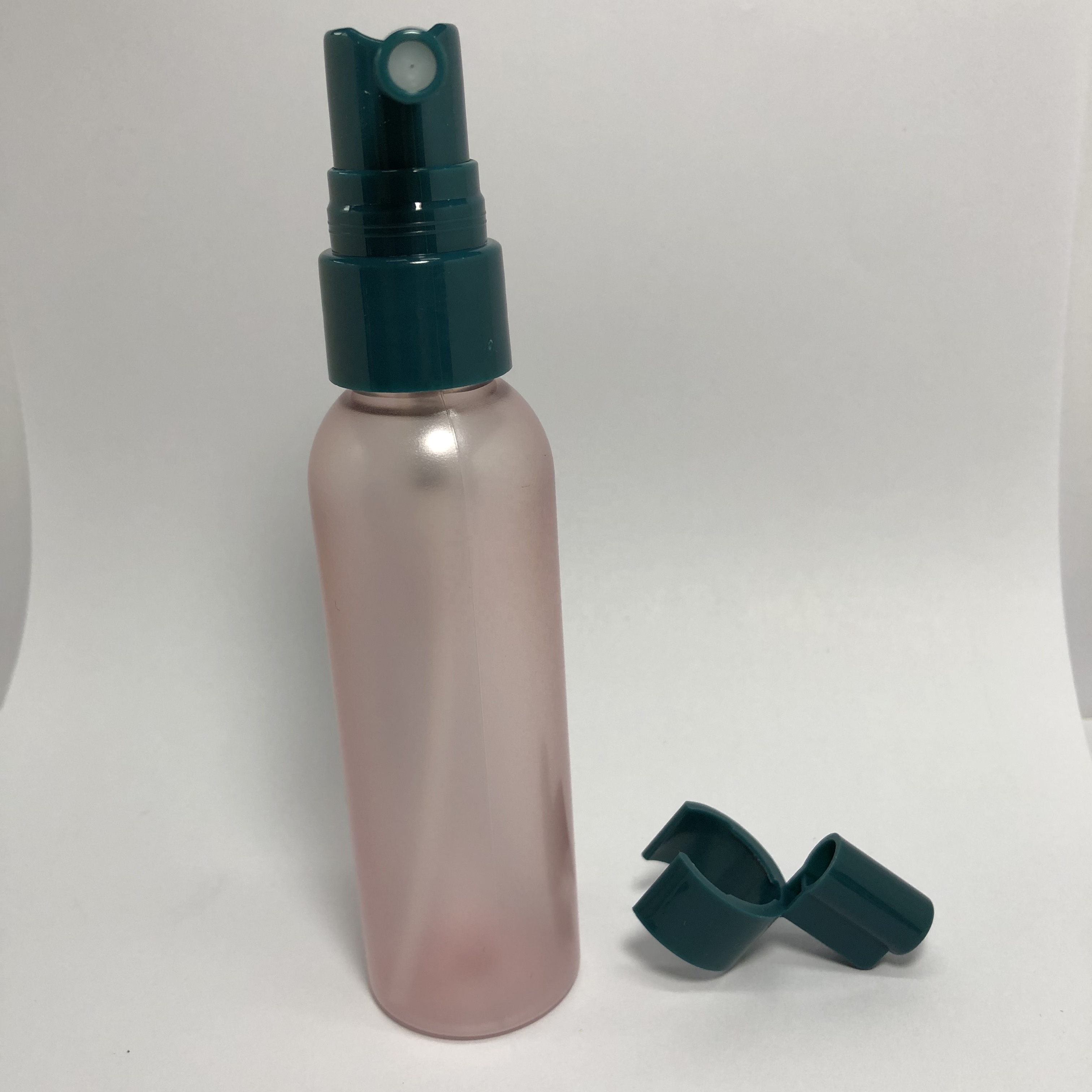 60ml pink semi-transparent plastic bottle with 20mm green sprayer pump
