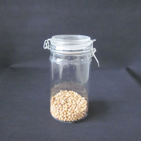 Airtight clear glass storage jars with glass clamp lids