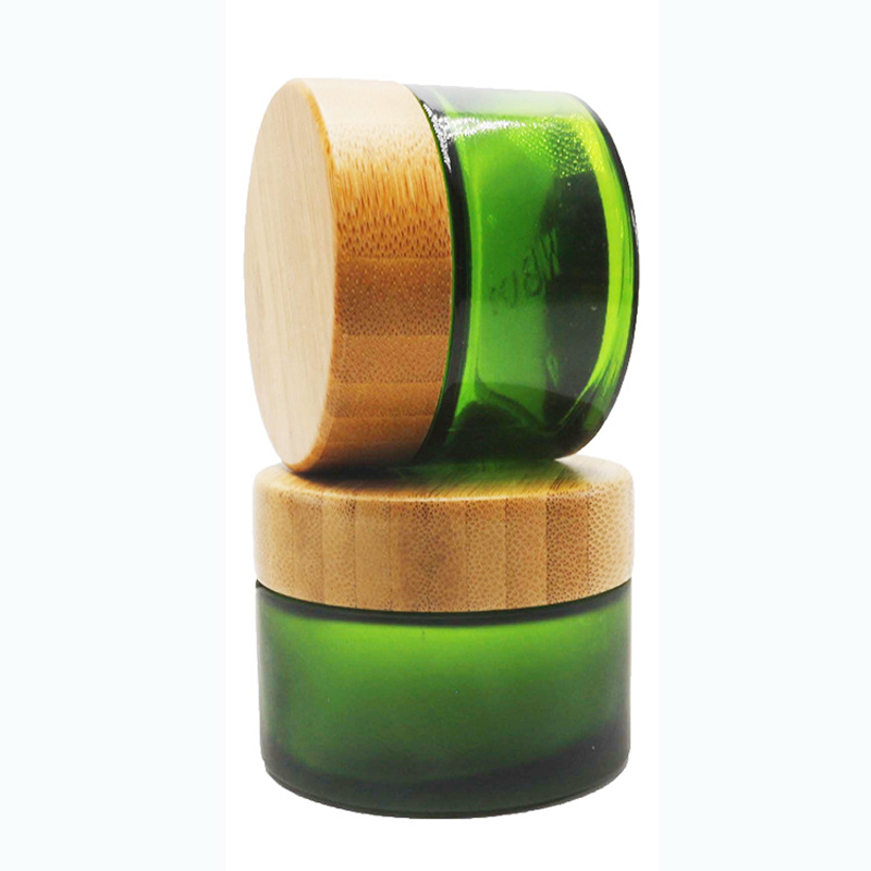 Bamboo containers for cosmetics glass jar 50g clear green glass wooden jar matte frosted green glass jar with engraved logo
