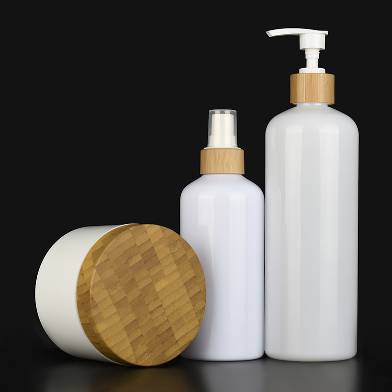 Bamboo series packaging white plastic pump bottles and white plastic cosmetic cream jars with Bamboo lids container