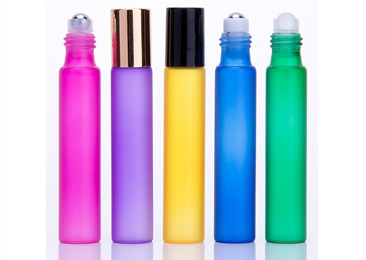 Beautiful 10ml small transparent glass round tube roller ball bottle with rose gold lid and stainless steel beads