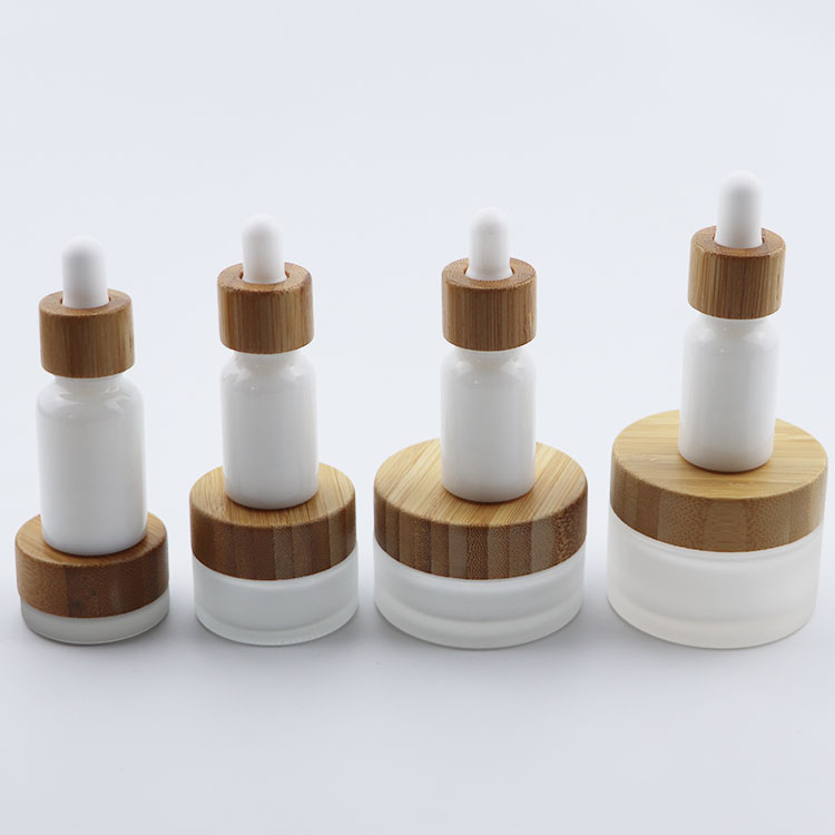 Beautiful elegant cosmetic glass bottle glass jar  with bamboo cap for packaging