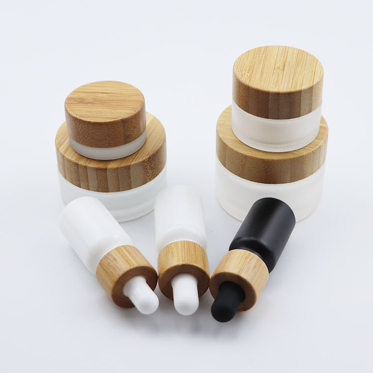 Beautiful elegant cosmetic glass bottle glass jar with bamboo cap for packaging