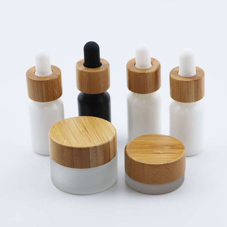Beautiful elegant cosmetic glass bottle glass jar with bamboo cap for packaging