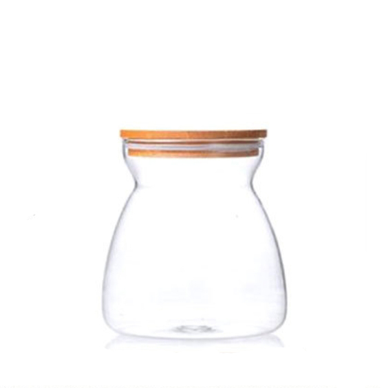 Beautifully shaped transparent glass sealed storage jar with bamboo lid