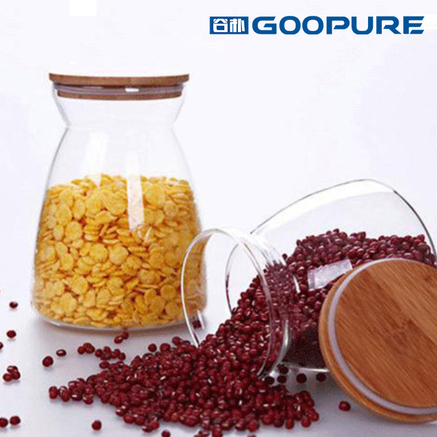 Beautifully shaped transparent glass sealed storage jar with bamboo lid