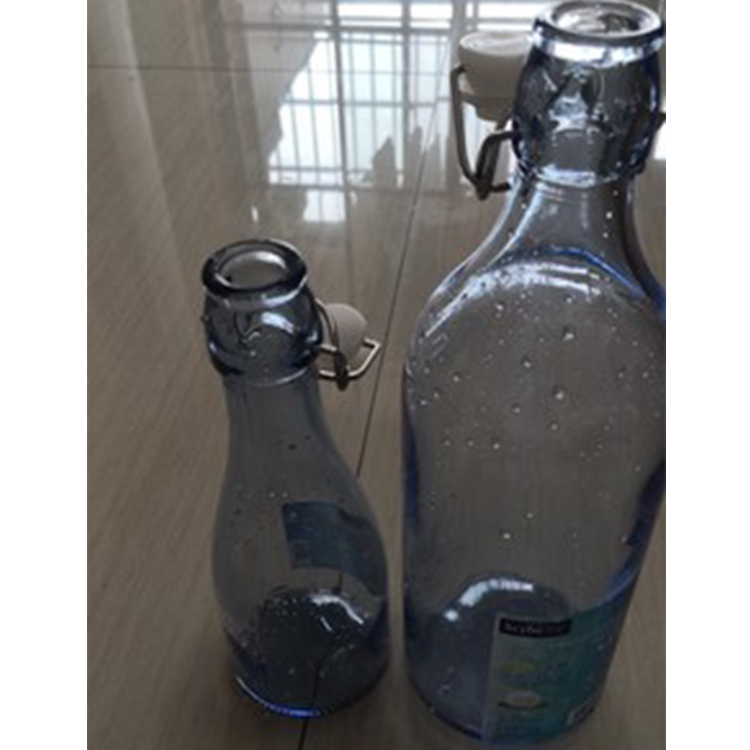 Best Selling 1000ml Clear Swing Top Embossed Round Glass Beverage Bottle for sales